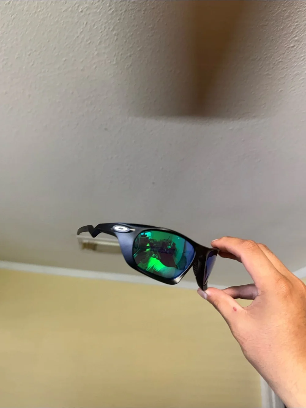 Oakley Black Frame Sunglasses with Green Mirror Lenses